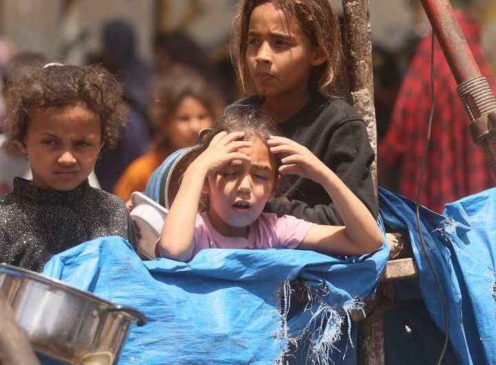 Children in Gaza wait in the hope of receiving food.